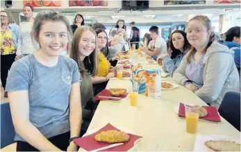  ??  ?? Good cause S1 pupils popped on a French breakfast to raise more cash