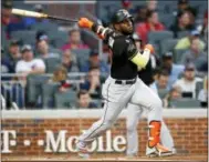  ?? BRETT DAVIS — THE ASSOCIATED PRESS ?? The Miami Marlins continued their rebuild Wednesday by trading All-Star outfielder Marcel Ozuna to the St. Louis Cardinals.