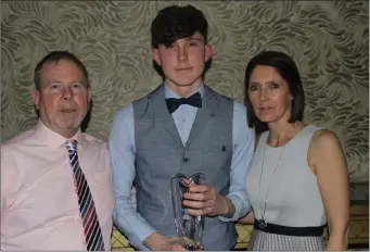  ??  ?? Aaron Tierney-Smith with his proud parents, Robbie and Frances.