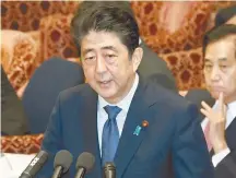  ?? AP-Yonhap ?? Japanese Prime Minister Shinzo Abe speaks during a session of the House of Representa­tives Budget Committee in Tokyo, Monday. Abe once again denied that he misused his influence to help a friend in a growing favoritism scandal as support ratings for...