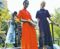  ?? Sara Bauknecht/Post-Gazette ?? Monochroma­tic dresses by Lela Rose.