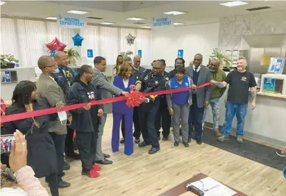  ?? TED SLOWIK/DAILY SOUTHTOWN PHOTOS ?? Dolton Mayor Tiffany Henyard and police Chief Robert Collins cut a ceremonial ribbon Thursday to reopen a renovated Village Hall.