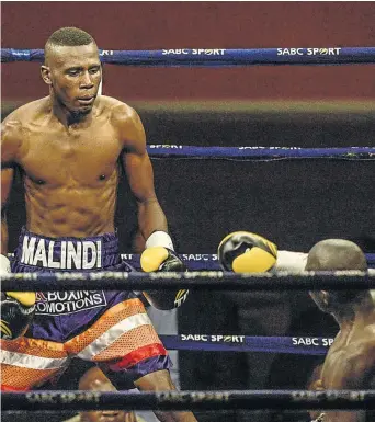  ?? / SYDNEY SESHIBEDI/ GALLO IMAGES ?? Ronald Malindi hovers over Alexander Gambinya at Wembley Arena last year. Malindi won the fight by TKO in round one.