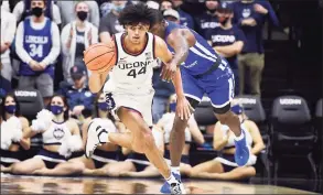  ?? Jessica Hill / Associated Press ?? Andre Jackson, left, and the UConn men’s basketball team will host Coppin State on Saturday.