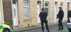  ??  ?? ● Police in Edleston Street after the fatal stabbing of Mark Fisher