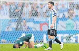  ?? AFP ?? Argentina’s Lionel Messi leaves the pitch after his team lost to Saudi Arabia.