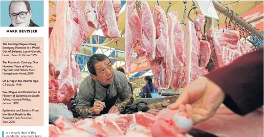  ?? /Reuters ?? Appetite for meat: A vendor calculates the price of pork bought by a customer at a market in Wuhan, capital of the Chinese province of Hubei, which in January 2020 became the first epicentre of Covid-19.