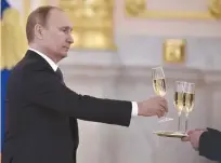  ?? (Kirill Kudryavtse­v/Reuters) ?? RUSSIAN PRESIDENT Vladimir Putin signed the law requiring foreign producers to only describe their product as sparkling wine on the bottle’s back label.