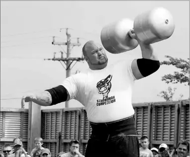  ?? — Photos by Colin Maclean/the Telegram ?? In top photos, Icelandic strongman Hafthor Bjornsson demonstrat­es his strength during NLL Recycling Ltd. Strongman Competitio­n 2012 in St. John’s.