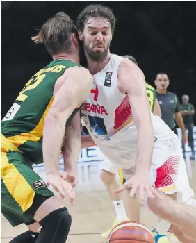  ?? EMMANUEL DUNAND/AFP/Getty Images ?? Spain’s Pau Gasol, right, scored 25 points as Spain regained the European basketball title Sunday by defeating Lithuania.