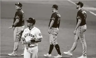  ?? KarenWarre­n / Staff photograph­er ?? The Astros’ Michael Brantley walks off the field after flying out to Rays outfielder Manuel Margot to end Game 3 of the American League Championsh­ip Series at Petco Park on Tuesday.