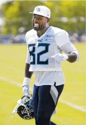  ?? THE ASSOCIATED PRESS ?? Tennessee Titans tight end Delanie Walker leaves the field after Friday’s practice in Nashville. Walker signed a contract extension that keeps him with the team through 2020. He led the Titans with 74 catches last season.