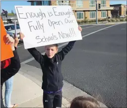  ?? Courtesy photo ?? Families gathered to rally for Yuba City Unified School District schools to fully reopen for in-person instructio­n five days per week on Tuesday.