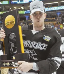  ?? ICON SPORTSWIRE FILE PHOTO ?? REAL TEAM PLAYER: Former Malden Catholic and Providence star Mark Adams, who died this week at age 27, poses with the trophy after helping lead the Friars to the 2015 national championsh­ip at the Garden.