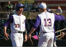  ?? RANDY MEYERS — THE MORNING JOURNAL ?? Avon’s Will Kocar is congratula­ted by teammate Logan Doenges after scoring against Amherst.