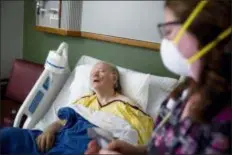  ?? DAVID GOLDMAN — THE ASSOCIATED PRESS ?? Henry Beverly, 73, battles the flu while tended to by nurse Kathleen Burks at Upson Regional Medical Center in Thomaston, Ga. As of January 2019, the current flu season is shaping up to be gentler than last winter’s unusually brutal one, health officials say.