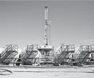  ?? Daniel Acker / Bloomberg ?? Tanks containing drilling fluid sit in a row near a Nabors Industries rig drilling in the Permian Basin. “U.S. oil will put its stamp on global oil developmen­ts in the next five years,” says Fatih Birol, executive director of the Internatio­nal Energy...