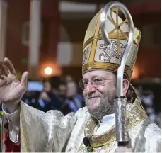  ?? AFP; Khushnum Bhandari / The National ?? Top, Pope Francis and Dr Ahmed Al Tayeb, the Grand Imam of Al Azhar, at the signing of the Document on Human Fraternity; above, Bishop Paolo Martinelli