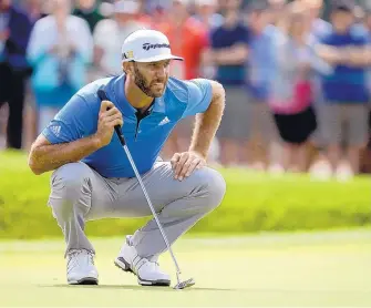  ?? JOHN MINICHILLO/ASSOCIATED PRESS ?? Dustin Johnson lines up his putt on the third hole during his rain-delayed first round Friday at Oakmont Country Club. He is 4 under through two rounds of the U.S. Open