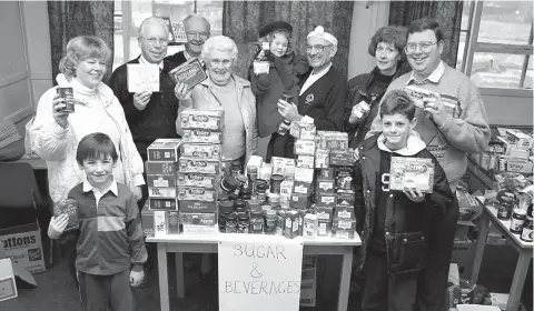  ?? ?? Lions club members showed off some of the goods they had collected in 1996. Ref:134106-11