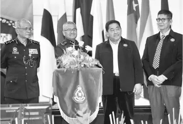  ??  ?? Mohamad Fuzi (second left) with Yayasan Pengaman chairman Tan Sri Norian Mai (second right) at the launching of Tabung Prihatin Pengaman at the Kuala Lumpur police training base yesterday. Also present are Deputy Inspector-General of Police Tan Sri...