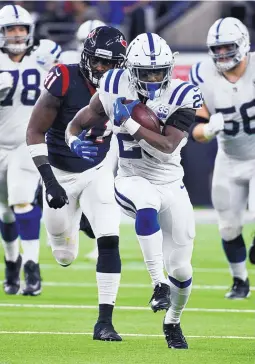  ?? ERIC CHRISTIAN SMITH/ASSOCIATED PRESS ?? Indianapol­is running back Marlon Mack (25) finds open space Saturday against Houston. The Colts defeated the host Texans in the first game of the NFL postseason.