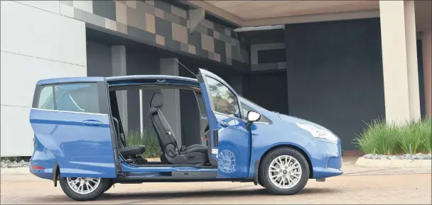  ??  ?? Sliding side doors make life so much easier for the familyman or woman with child seats (below) or groceries to load. Engine is 1-litre, 3-cylinder Ecoboost unit.