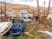  ?? British Ministry of Defense via Associated Press ?? Cars wrecked by Hurricane Irma are strewn about the British Virgin Islands. The Caribbean paradise islands took the full force of Irma when it was at its strongest.