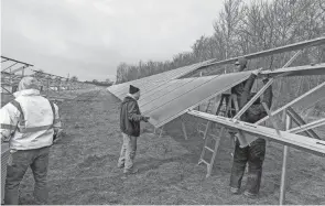  ?? ROGER LAPOINTE/THE NEWS-MESSENGER ?? Solar panels were installed earlier this year near Fremont in Sandusky County. A proposed solar facility, if completed in Marion County, would take up 404 acres in eastern Pleasant Township and have a capacity of producing up to 68 megawatts of electricit­y.