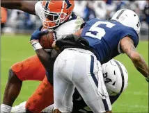  ?? BARRY REEGER/AP 2021 ?? The 6-foot-1, 296-pound Derrick Tangelo (54), who was a Penn State defensive tackle, played at Duke from 2017-20, then one season for the Nittany Lions. He’s a cousin of former Falcons linebacker Prince Shembo.