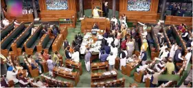  ?? ?? Opposition MPS shout slogans in the Well of the Lok Sabha demanding a Joint Parliament­ary Committee (JPC) probe in the Adani controvers­y, in New Delhi on Tuesday. ANI/SANSADTV