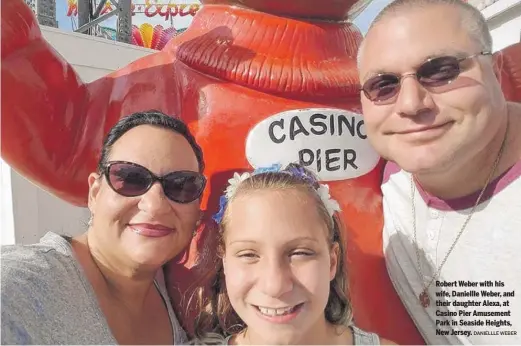  ?? DANIELLLE WEBER ?? Robert Weber with his wife, Daniellle Weber, and their daughter Alexa, at Casino Pier Amusement Park in Seaside Heights, New Jersey.