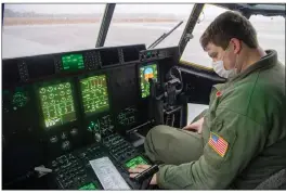  ?? SENIOR AIRMAN AARON IRVIN/U.S. AIR FORCE ?? Air Force Reserve Master Sgt. Michael Hopson, 327th Airlift Squadron loadmaster, conducts a preflight check on a C-130J Super Hercules during exercise Panther Storm at Joint Base Charleston, South Carolina, on Feb. 1. The Panther Storm exercise validates Mobility Air Force’s ability to deliver a large contingent of ground forces anywhere in the world in under 18 hours. The Air Force Reserve plays an integral role by adding additional manpower and surge capacity required to execute the high-end fight.