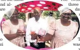  ??  ?? Harry Mabaso, his wife Selina, right, and her twin sister Caroline Hlekane share a toast.