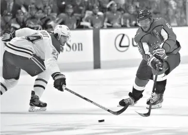  ?? Associated Press ?? Washington Capitals left wing Alex Ovechkin (8), of Russia, battles for the puck against Montreal Canadiens center Phillip Danault (24) during the first period of a NHL hockey game Saturday in Washington.