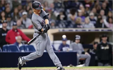  ?? ORLANDO RAMIREZ — THE ASSOCIATED PRESS FILE ?? In this April 2, 2019, file photo, Arizona Diamondbac­ks pitcher Zack Greinke hits a three-run home run against the San Diego Padres. While pitchers have always been viewed as the weakest link in the batting order, there was a time when they weren’t automatic outs.