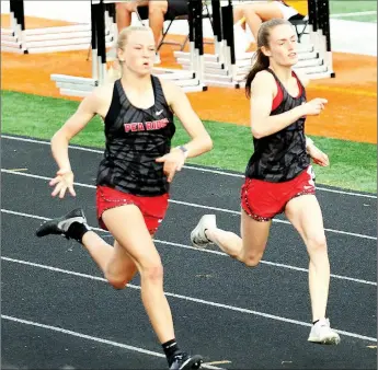  ?? Photograph courtesy Ranee Nunley ?? Lady Blackhawks Blakelee Winn and Cassidy Mooneyhan came in first and second in both the 100-Meter Dash (12.36, 12.53) and 200-Meter Dash (26.30, 26.57) at the state track meet in Batesville last week.