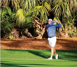  ?? GREGORY SHAMUS / GETTY IMAGES ?? Justin Thomas plays a shot during a practice round for The Players Championsh­ip at TPC Sawgrass in Ponte Vedra Beach, Fla., on Wednesday. Rye overseed is making the course lush and longer than when TPC was held in May on Bermuda grass.