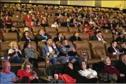  ?? BRITTANY GREESON / THE NEW YORK TIMES ?? Attendees watch President Donald Trump’s State of the Union address during a watch party at a movie theater Tuesday in Novi, Mich.