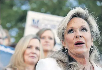  ?? [BRYNN ANDERSON/THE ASSOCIATED PRESS] ?? Kayla Moore, right, speaks at a news conference Friday in support of her husband, Senate candidate Roy Moore, in Montgomery, Ala.