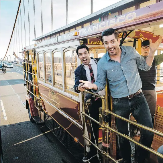  ?? CORUS ?? Drew, left, and twin brother Jonathan Scott riding along the Golden Gate Bridge in San Francisco, Calif., the location for this season of Brother vs. Brother, where the siblings challenge each other to see who can make the most money renovating and...