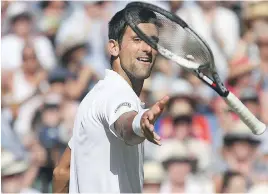  ?? AP ?? Novak Djokovic of Serbia gives his racquet a toss after defeating Kevin Anderson of South Africa in the men’s singles final match at Wimbledon on Sunday.