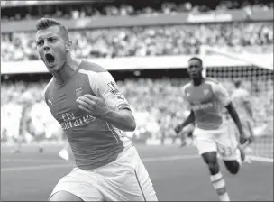  ?? Associated Press ?? Arsenal's Jack Wilshere celebrates scoring a goal Sept. 13, 2014, during the English Premier League soccer match between Arsenal and Manchester City at Emirates Stadium in London. Wilshere has left Arsenal for a season-long loan at Bournemout­h in a bid...