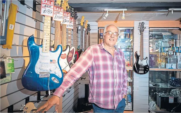  ??  ?? Shop owner Pete Caban has decided to close his music shop, Bandwagon, after more than 40 years in business.