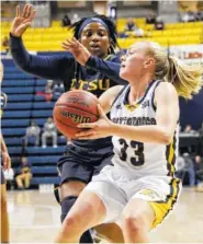  ?? STAFF FILE PHOTO BY DOUG STRICKLAND ?? UTC guard Lakelyn Bouldin looks to pass against East Tennessee State guard Shy Copney during last season’s game at McKenzie Arena.