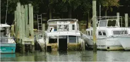  ?? STAFF FILE ?? Students with Virginia Coastal Policy Center at William & Mary Law School helped research removing abandoned boats from waterways.