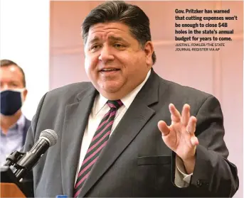  ?? JUSTIN L. FOWLER/THE STATE JOURNAL-REGISTER VIA AP ?? Gov. Pritzker has warned that cutting expenses won’t be enough to close $4B holes in the state’s annual budget for years to come.