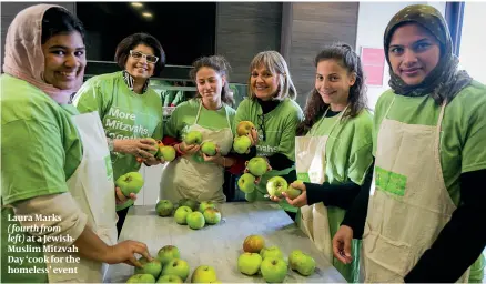  ?? ?? Laura Marks
( fourth from left) at a JewishMusl­im Mitzvah Day ‘cook for the homeless’ event