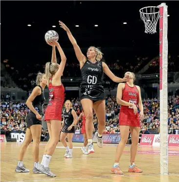  ?? ACTIONPLUS/PHOTOSPORT ?? Silber Ferns goal defence Casey Kopua leaps high to block a shot by England’s Helen Housby during yesterday’s match in Liverpool.