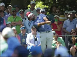  ?? MATT SLOCUM — THE ASSOCIATED PRESS ?? Scottie Scheffler hits his tee shot on the seventh hole during the second round at the Masters at Augusta National Golf Club on Friday.